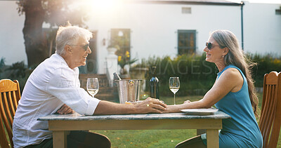Buy stock photo Love, holding hands and wine with old couple in nature for romance, anniversary date and bonding. Happiness, retirement and support with senior man and woman at resort for glass, relax and vacation