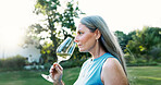 Smell, wine or woman at vineyard with glass, luxury drink or holiday at farm or countryside. Winery, scent or mature person tasting alcohol beverage outdoor, thinking or aroma for quality on vacation