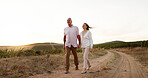 Farm, walking and holding hands with senior couple, love and relationship with vacation for honeymoon. People, outdoor or dirt road with old man, mature woman and countryside with romance or marriage