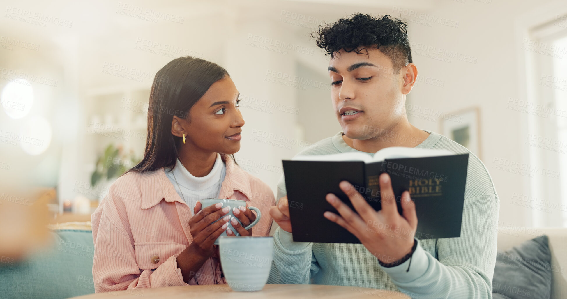 Buy stock photo Home, reading bible or couple in lounge, religion or scripture with guidance. People, apartment or man with woman, coffee or learning with holy book, Christianity gospel or praise together with faith