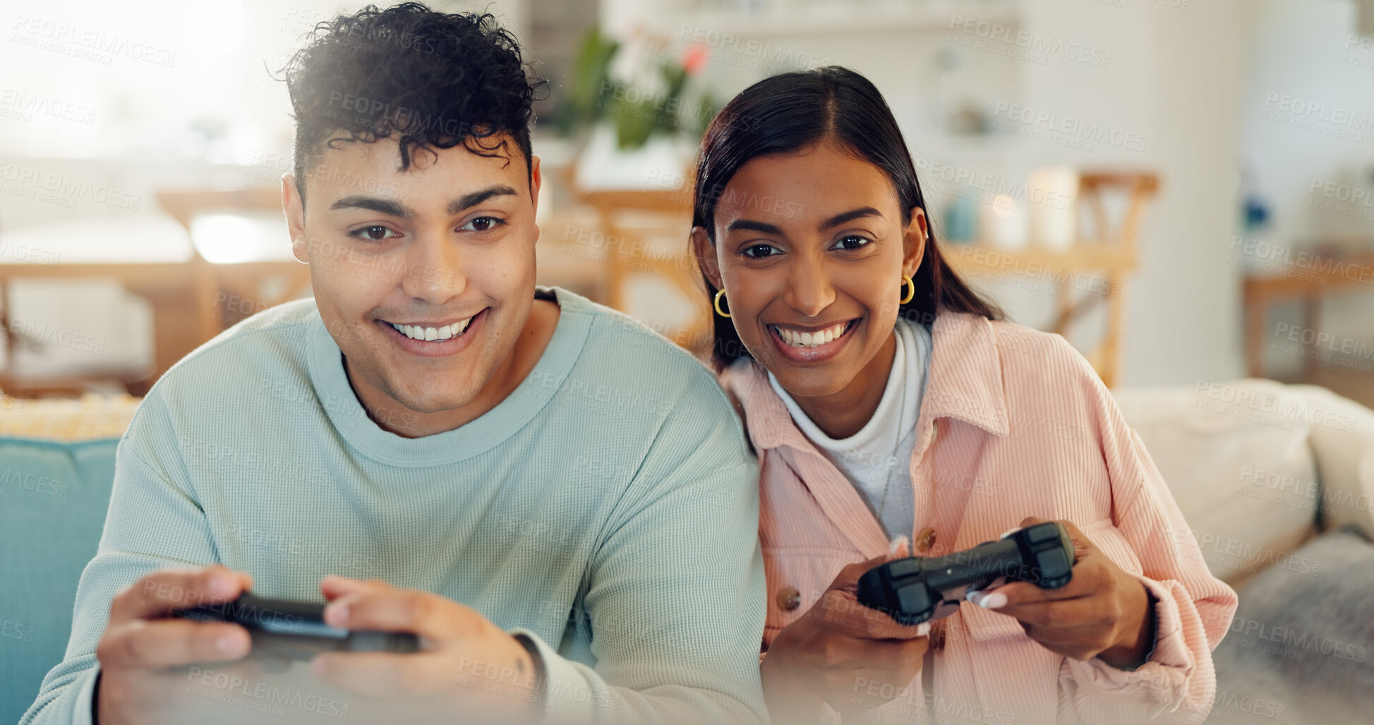 Buy stock photo Playful, smile and gaming with couple on sofa for esports challenge, arcade and competition. Happiness, streaming and contest with man and woman in living room at home with gamer controller and fun