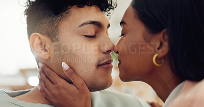 Buy stock photo Couple, relax and affection with love at house for kiss, passion and partner for support in living room. People, romance and bonding together for relationship commitment, connection and weekend break