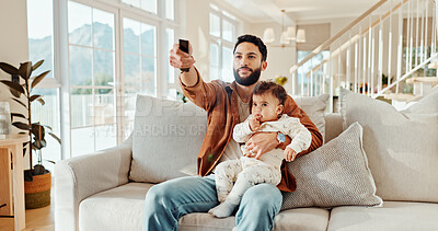 Buy stock photo Relax, dad and watching tv with baby, home and man with remote control for choice, movies and lounge. Bonding, father and cartoons for daughter in living room, entertainment and parent with child