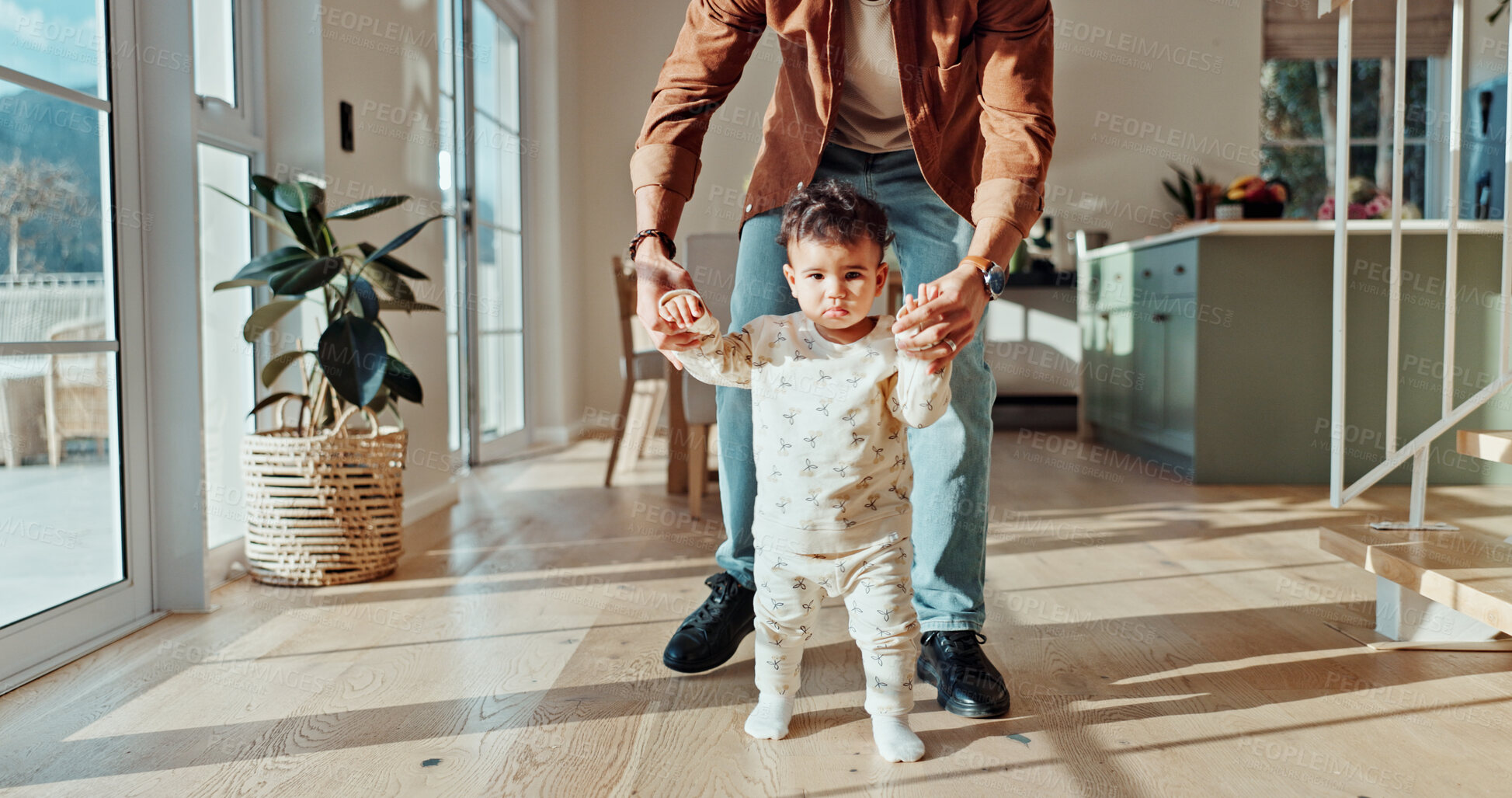 Buy stock photo First steps, learning or walking with parent and toddler in home for child development or growth. Balance, mobility support with person teaching baby how to move in apartment for motor skills