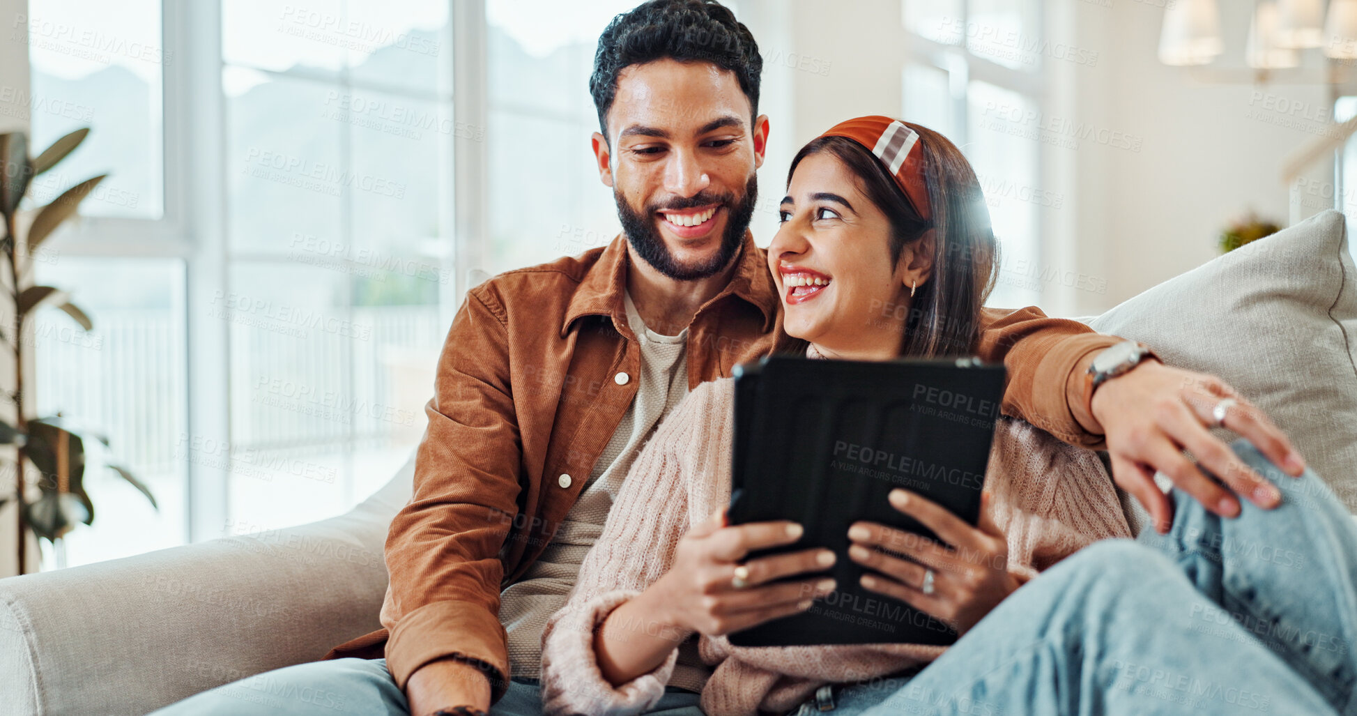 Buy stock photo Bonding, laughing and couple with tablet, entertainment and subscription to app for streaming or online. Happy, woman and man with movies in living room, watching or people with tech for date in home