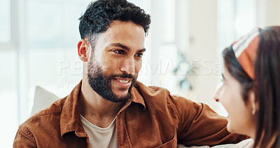 Buy stock photo Couple, relax and talk with smile at house for discussion, bonding together and weekend break on sofa. Happy, people and conversation for romance, partner support and relationship commitment on couch