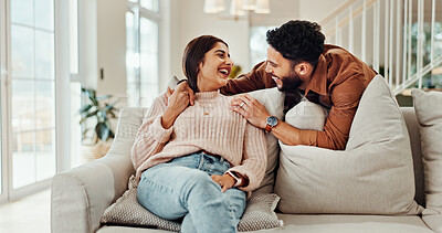 Buy stock photo Smile, couple and talking on couch at house with discussion, bonding together and weekend break. Happy, people and embrace for funny conversation, romance and partner care of relationship commitment 