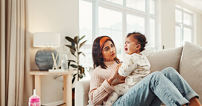 Buy stock photo Comfort, crying and mother with baby on sofa in living room of home for emotional development. Empathy, growth or sadness with single parent woman and child in apartment for childcare or safety