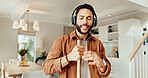 Music, sing and sweeping with man in home for chores, responsibility or spring cleaning. Broom, dance and headphones with happy person in apartment for housekeeping, listening or radio streaming