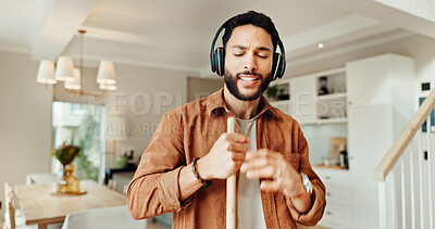 Buy stock photo Music, sing and sweeping with man in home for chores, responsibility or spring cleaning. Broom, dance and headphones with happy person in apartment for housekeeping, listening or radio streaming