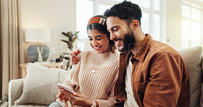 Buy stock photo Smile, couple and relax with phone at house for good news, financial banking and loan application. Happy, people and embrace with mobile for research, bills payment and feedback of mortgage insurance