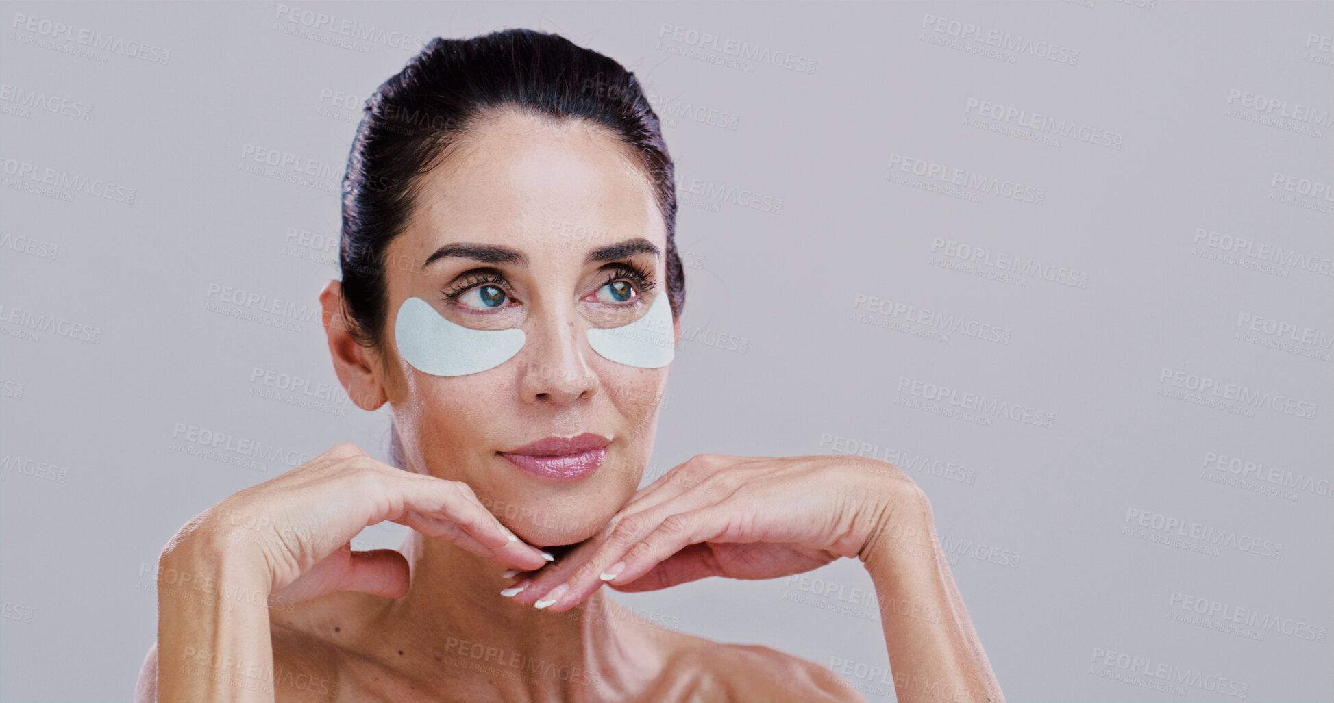 Buy stock photo Beauty, mature woman and eye patches in studio for wrinkle reduction, firm skin treatment or hyaluronic acid. Mockup, person and confidence with cosmetics product for dark circles on white background