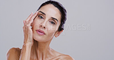 Buy stock photo Beauty, skincare and portrait of mature woman in studio for collagen, anti aging treatment and self care. Glow, mockup space and dermatology with person on background for facial, shine and aesthetic