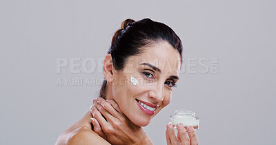 Buy stock photo Portrait, skincare or woman with face cream in studio for skin moisturizer, wrinkle reduction or anti aging treatment. Space, mature person or beauty product for hydration or glow on white background