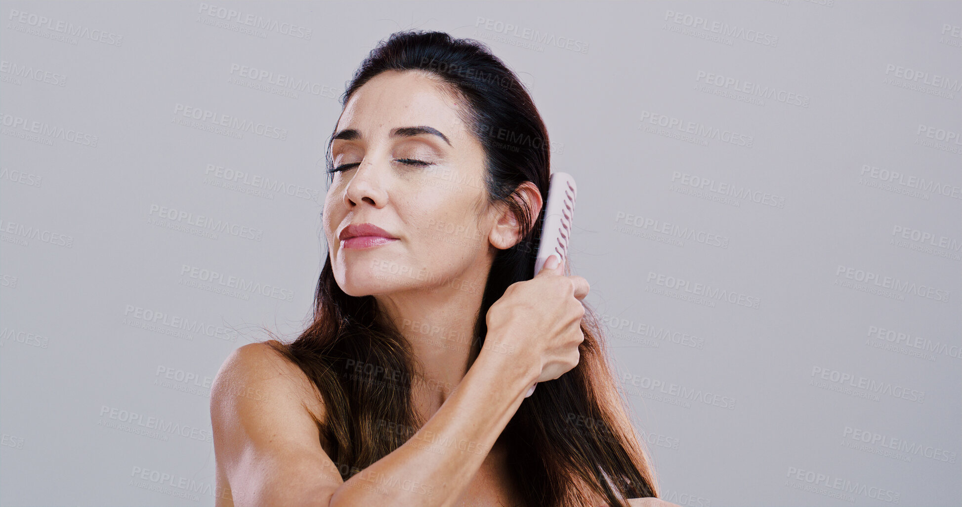 Buy stock photo Haircare, cosmetics and woman with brush in studio for healthy shine, growth benefits or grooming routine. Mockup, mature person and styling tool for self care, beauty or wellness on white background