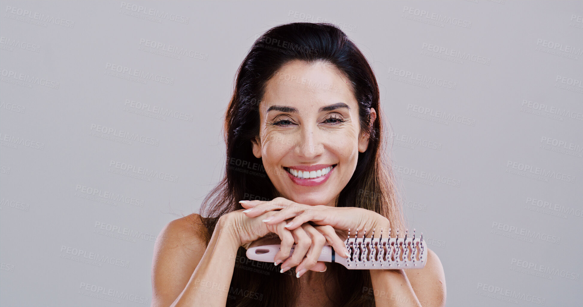 Buy stock photo Cosmetics, portrait and woman with hairbrush in studio for natural growth, scalp stimulation and grooming. Mockup, mature person and styling tool for volume hairstyle or beauty on white background