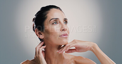 Buy stock photo Skincare, thinking and woman with beauty, glow and idea for anti aging treatment. Mature model, natural cosmetics and facial dermatology for self care, wellness and health on gray studio background