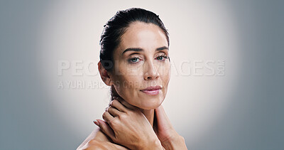 Buy stock photo Beauty, portrait and skincare with woman in studio for antiaging treatment or wellness routine. Aesthetic, cosmetics and dermatology with mature model on gray background for facial transformation