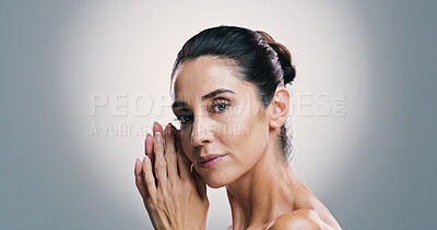 Buy stock photo Mature woman, portrait and skincare in studio with relax, anti aging treatment and confidence. Model, dermatology or glow on gray background space with facial care, natural cosmetics or skin wellness