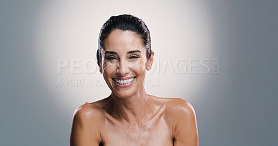 Buy stock photo Skincare, smile and mature woman with glow, studio and treatment for shine of skin, antiaging and cosmetics. Gray background, mockup space and happy for results of dermatology, portrait and wellness