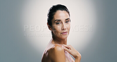 Buy stock photo Beauty, portrait and mature woman with skincare, studio and treatment for shine of skin, antiaging and cosmetics. Gray background, mockup space and proud of glow with dermatology, person and wellness
