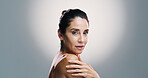 Portrait, cosmetics and mature woman with skincare, confident and treatment for shine of skin and studio. Gray background, mockup space and glow with dermatology, proud and wellness for person