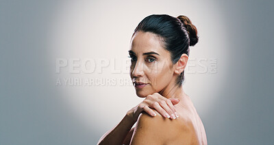 Buy stock photo Woman, portrait and skincare in studio with shoulder, anti aging treatment and beauty. Mature model, dermatology and relax on gray background space for facial care, natural cosmetics or skin wellness