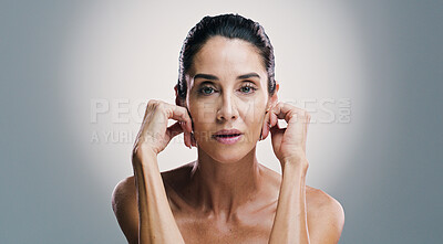 Buy stock photo Confident, cosmetics and mature woman with skincare, portrait and treatment for shine of skin and studio. Gray background, mockup space and glow with dermatology, proud and wellness for person