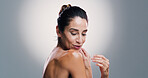 Smile, woman and skincare beauty in studio for anti-aging, treatment and dermatology benefits. Mature person, shoulder and shine of body transformation, natural glow and cosmetics in white background