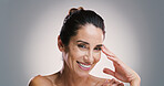 Skincare, portrait and happy woman with beauty, dermatology and facial treatment for anti aging. Mature model, face and natural cosmetics for glow, aesthetic and health on gray studio background