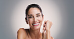 Skincare, portrait and happy woman with glow, dermatology and facial treatment for anti aging. Mature model, face and natural cosmetics for beauty, aesthetic and health on gray studio background