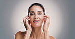 Natural skincare, portrait and happy woman with glow, dermatology and facial treatment for anti aging. Mature model, face and cosmetics for beauty, aesthetic or skin texture on gray studio background