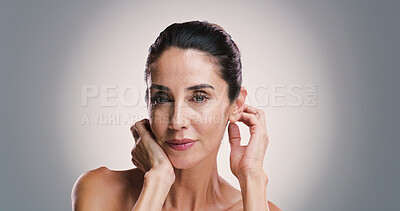Buy stock photo Natural skincare, portrait and woman with glow, dermatology and treatment for anti aging. Mature model, confident face and beauty cosmetics, aesthetic or skin texture on gray studio background space