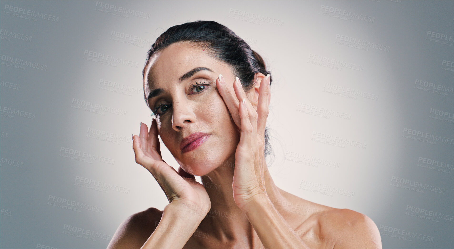 Buy stock photo Natural skincare, portrait and woman with glow, touch and results of collagen treatment for anti aging. Mature model, confident face and cosmetics, dermatology and beauty on gray studio background