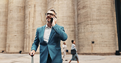 Buy stock photo Phone call, suitcase and businessman in city for travel, conversation and flight schedule update. Mature person, luggage and mobile for communication, business trip and thinking of work journey