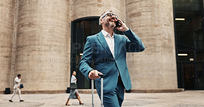 Buy stock photo Phone call, travel and businessman laugh in city, conversation or flight schedule update. Suitcase, happy and mature person on mobile for communication, funny joke and walk on work journey for trip