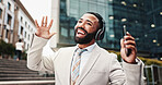 Dancing, man and phone with headphones in city for music playlist, morning commute and streaming audio. Business, happy person and singing outdoor for radio track, sound subscription and work break