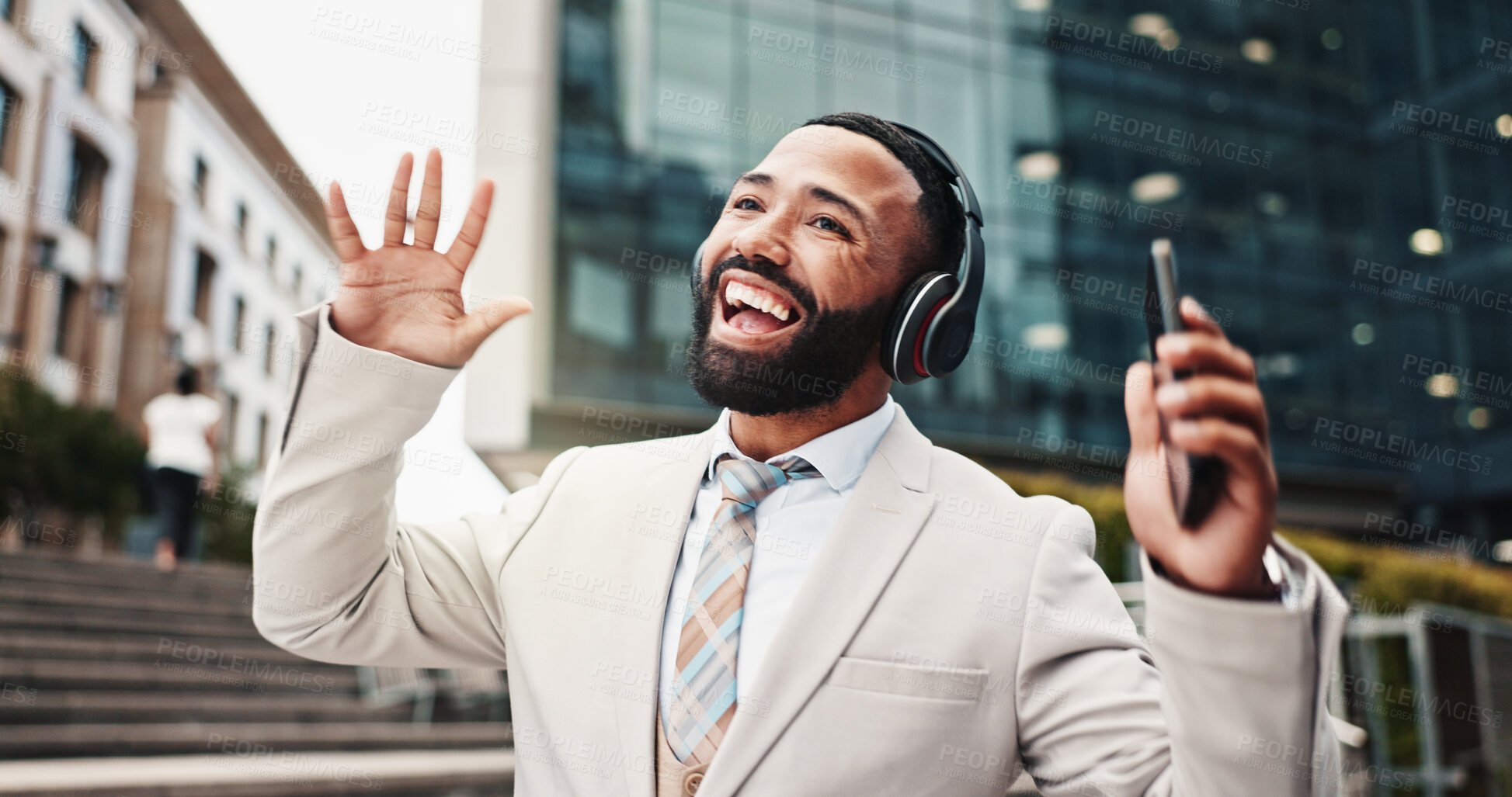 Buy stock photo Dancing, man and phone with headphones in city for music playlist, morning energy and streaming audio. Business, happy person and singing outdoor for radio track, sound subscription and work break