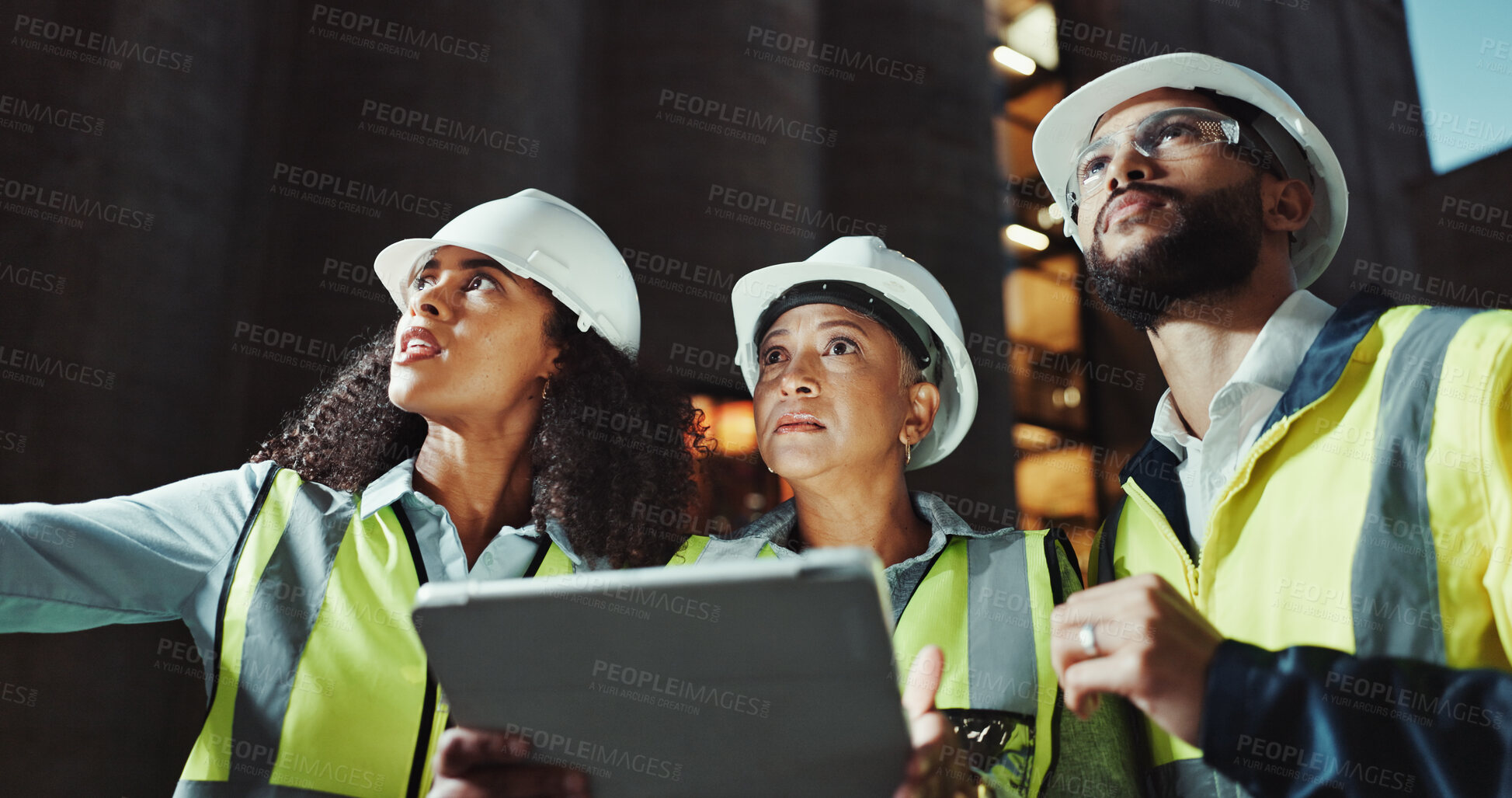 Buy stock photo Night, engineering and people with tablet, below and property inspection with app for schedule. Group, building development or employees with tech, evening or online planning for construction project