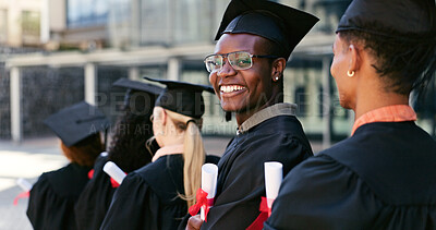 Buy stock photo Graduate, ceremony or portrait of happy man at university for education goal, school or success. Queue, graduation or confident student in line at campus with knowledge, smile or college achievement