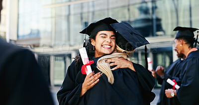 Buy stock photo Smile, students and hug at graduation outdoor of learning success, achievement and celebration. Excited, women and embrace for congratulation, academic degree and bonding together of college ceremony