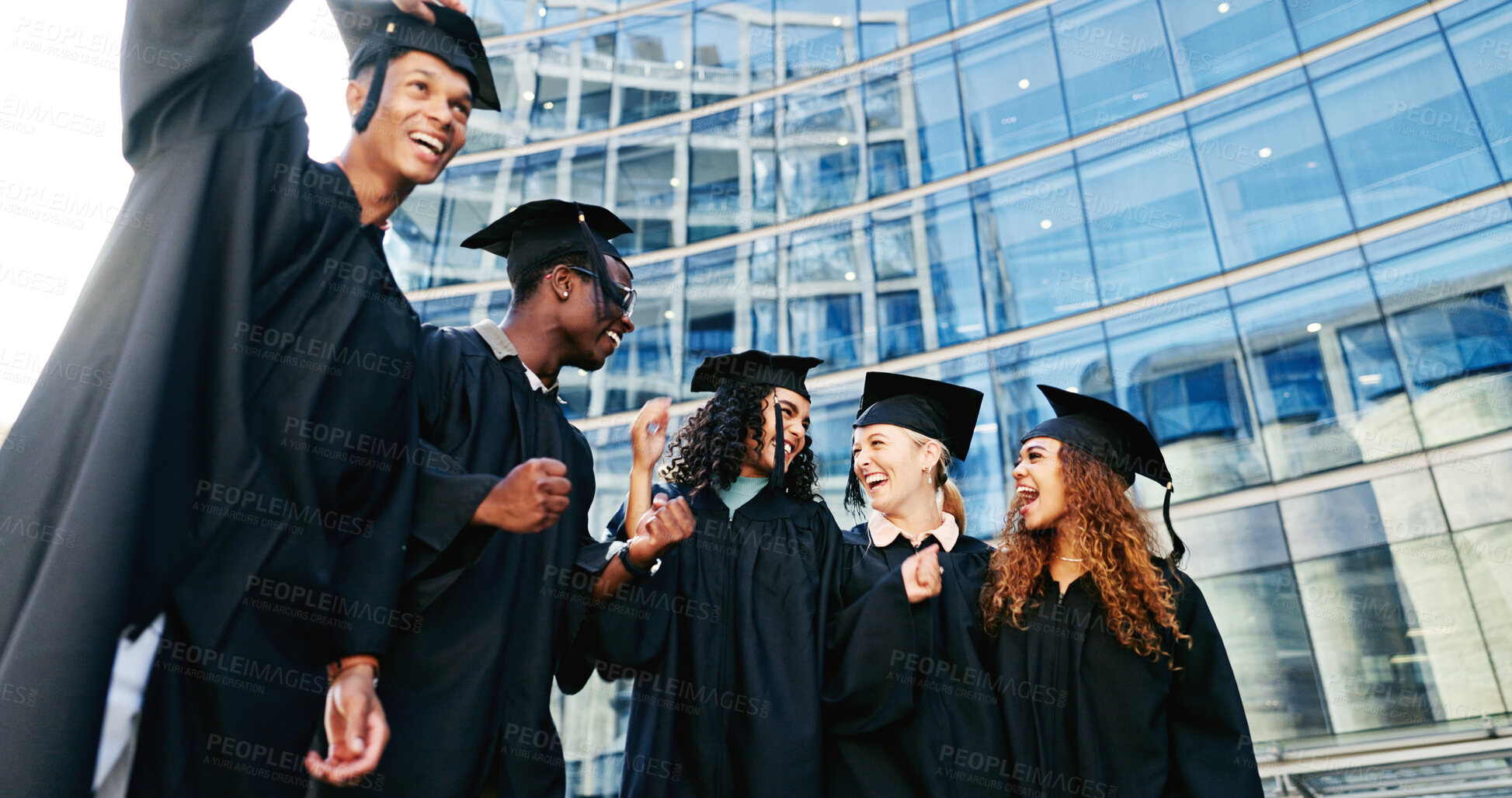 Buy stock photo Happy, students and laugh at graduation outdoor of learning success, class achievement and celebrate. Below, people and funny joke with support, academic degree and bonding together for college goals