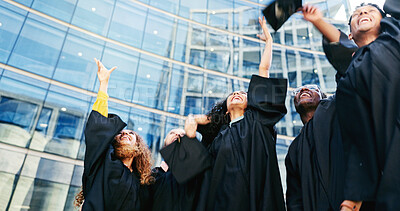 Buy stock photo Excited, students and throw hat for graduation of learning success, class achievement and celebrate. Below, people and tradition with support, academic degree and bonding together of college ceremony