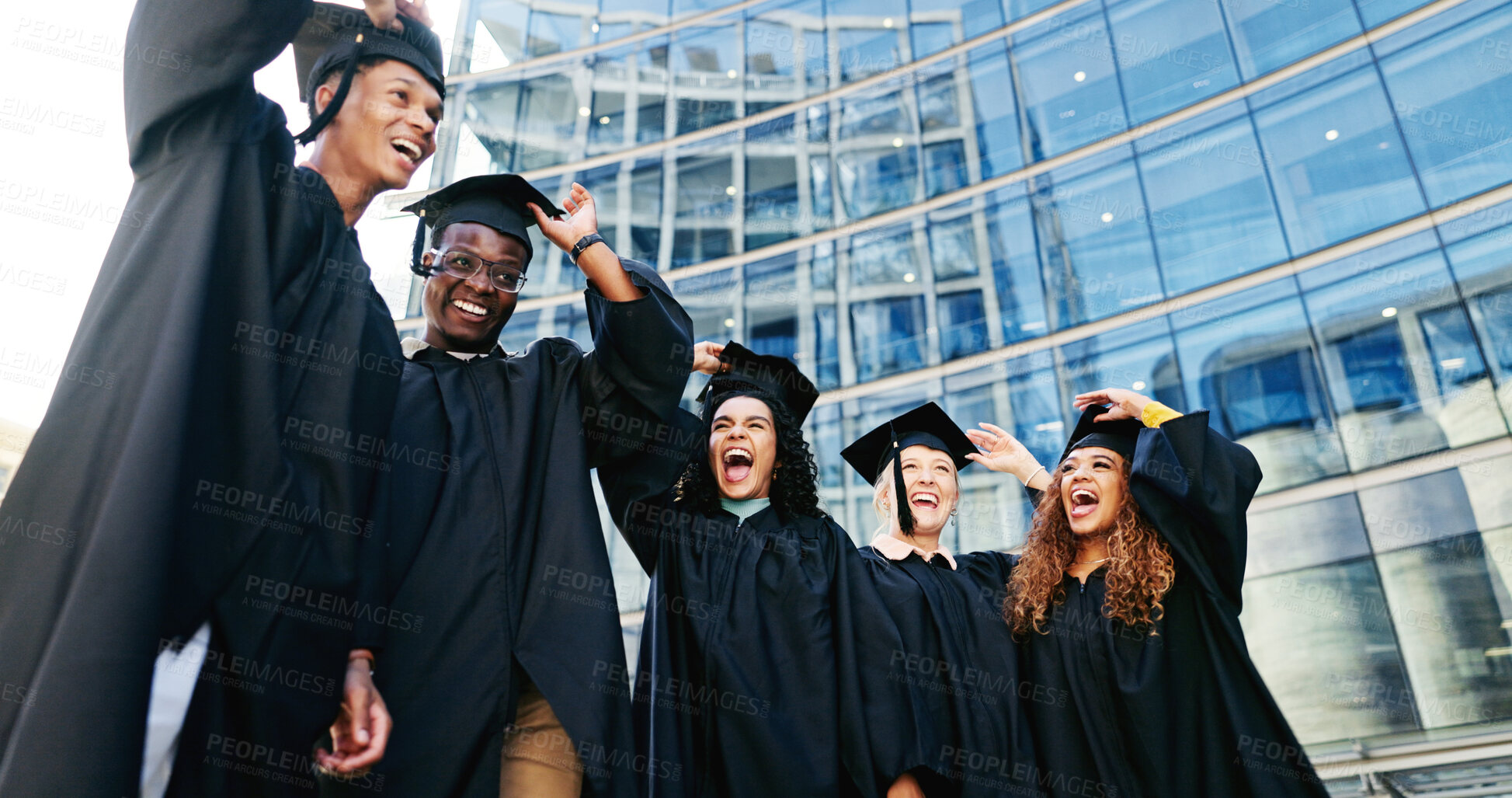 Buy stock photo Excited, people and throw hat for graduation of learning success, class achievement and celebrate. Below, students and tradition of congratulations, academic degree and bonding at university ceremony