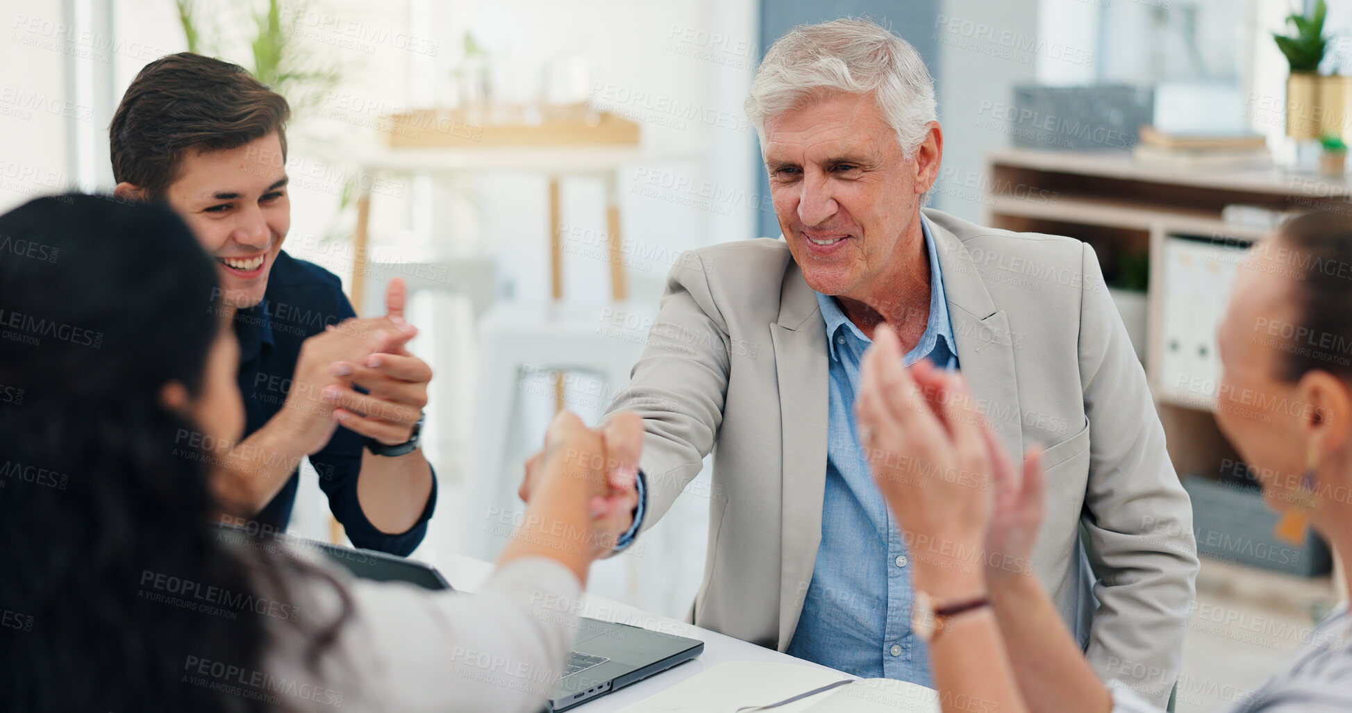 Buy stock photo Success, handshake and deal with business people in meeting for support, celebration and approval. Achievement, funding grant and applause with group of employees in office for news, b2b and results