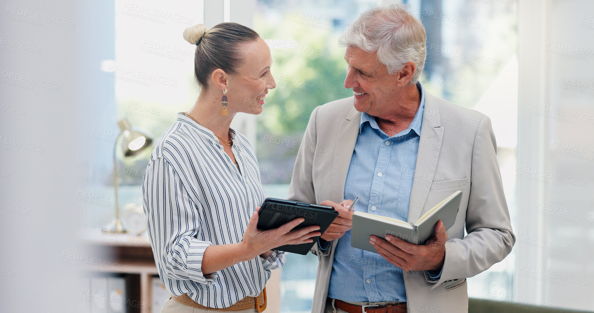 Buy stock photo Office, business people and teamwork with tablet for laughing, news information and notes with writers. Collaboration, journalist and mature editor with digital for online article, blog or funny joke