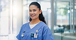 Woman, nurse practitioner and smile in portrait at hospital for healthcare services, pride or job in lobby. Person, happy and career with medical consulting, confident and wellness clinic in Colombia