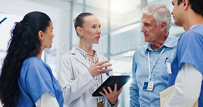 Buy stock photo Doctors, team and tablet for hospital management with discussion for funding, planning and review. People, leader and group with surgeon, problem solving and feedback with app at wellness clinic