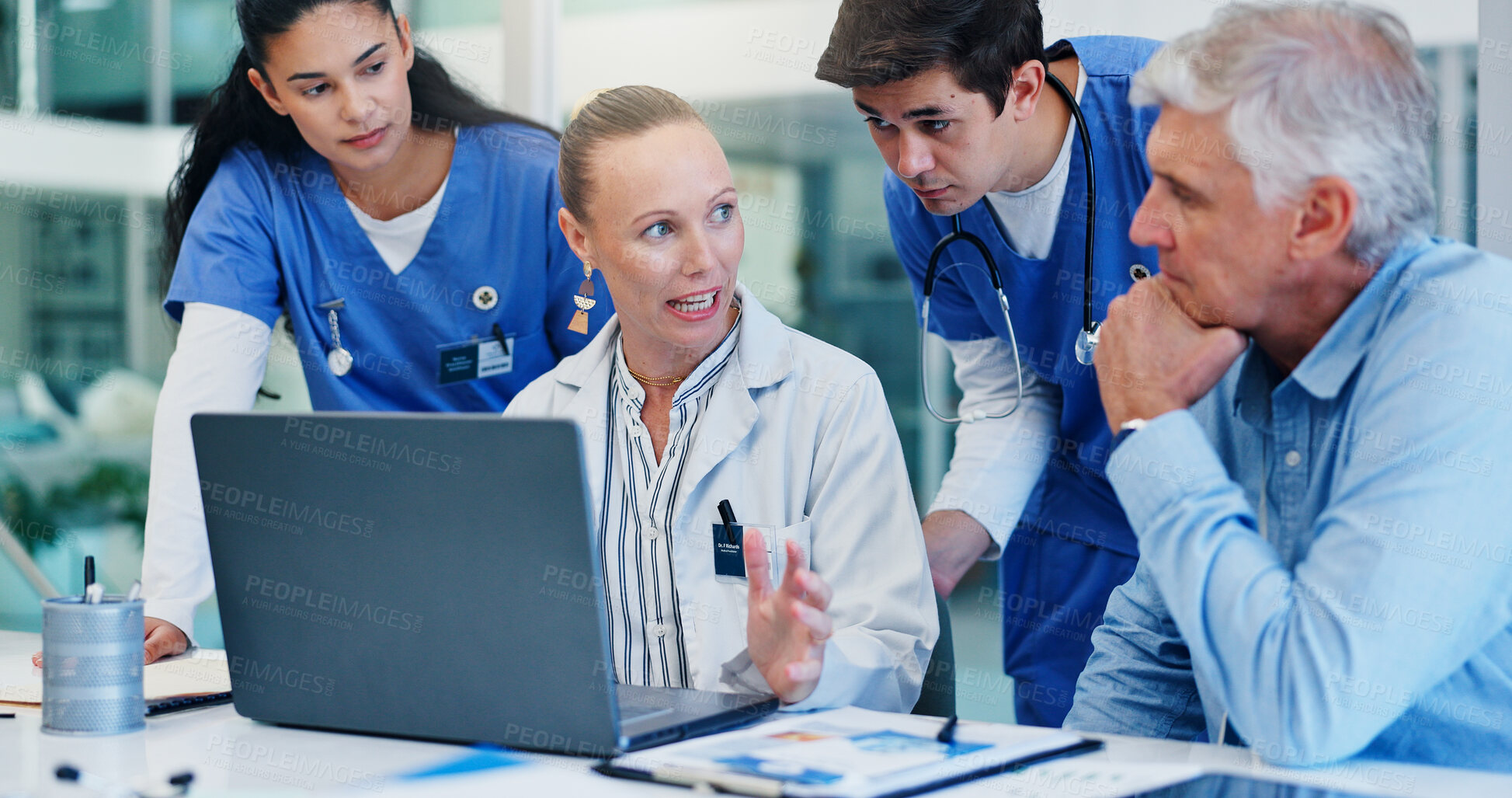 Buy stock photo Woman, doctors and laptop with group at hospital with discussion for funding, management and review. People, leader and team with surgeon, problem solving and feedback with pc at wellness clinic