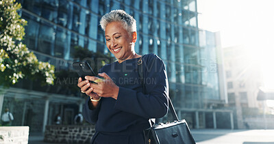 Buy stock photo Reading, phone and business with woman in city for stock market report, smile and investment app. Trader portfolio, communication and client chat with mature person outdoor for mobile and networking
